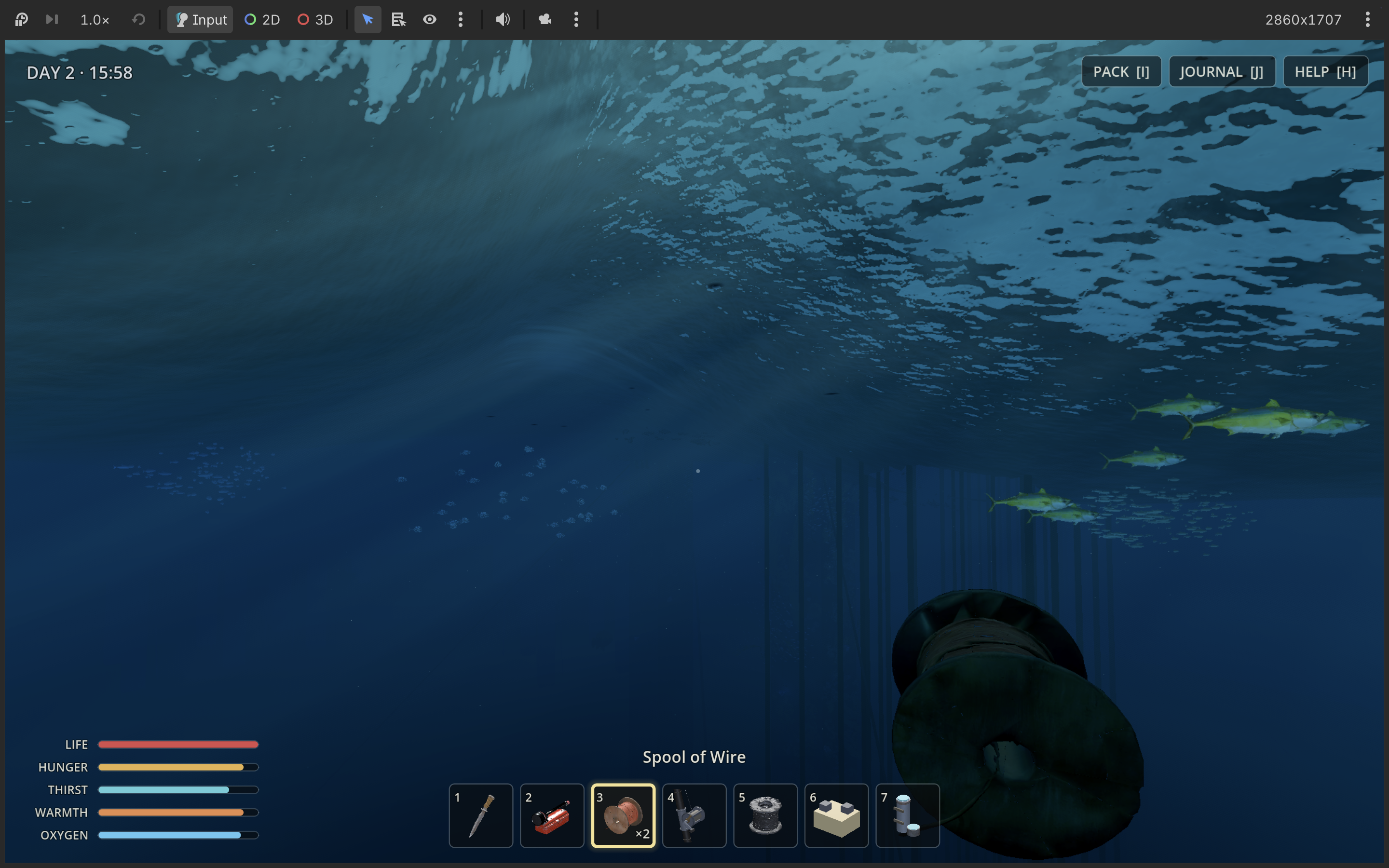 Schools of fish swimming beneath the surface of the sea beside submerged rig structures